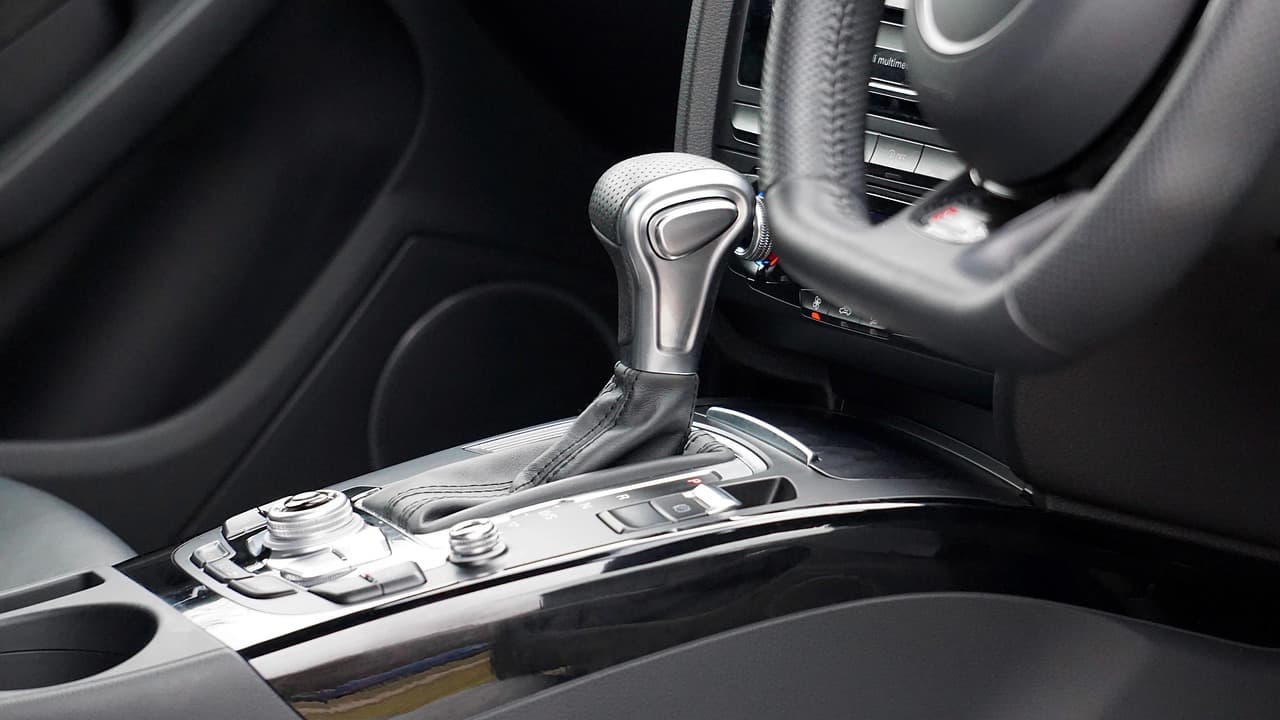 An automatic gear selector beside a right-hand-drive steering wheel